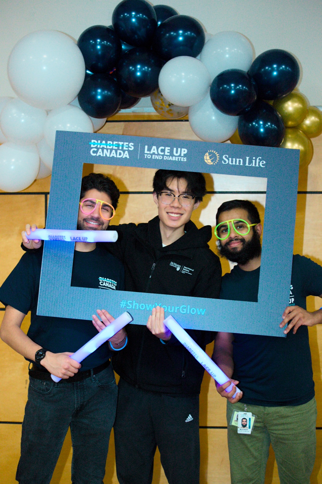 Three members with rackets in the photo frame